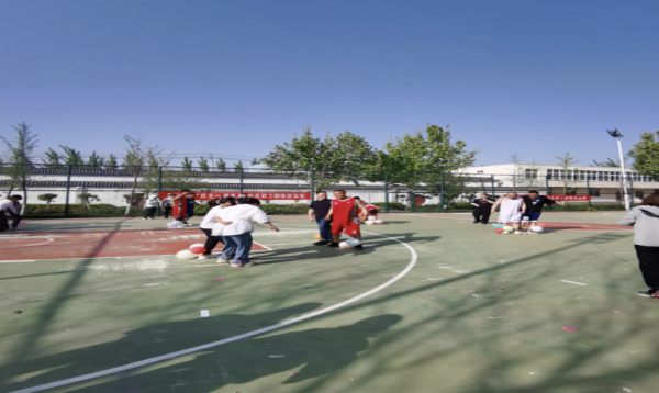 九龙证券 唐口街道举行 “庆五一 展风采”机关职工运动会